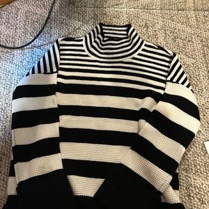 Black/cream striped sweater, Devotion by Cyrus, never warn with tags.